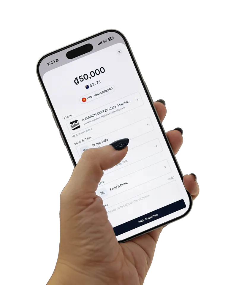 Budgeee app on a phone held in hand